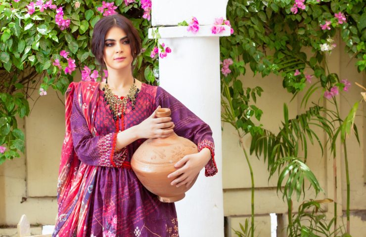 cute-young-girl-landscape-holding-clay-vase-wearing-traditional-dress-with-flowers-outdoor-shoot